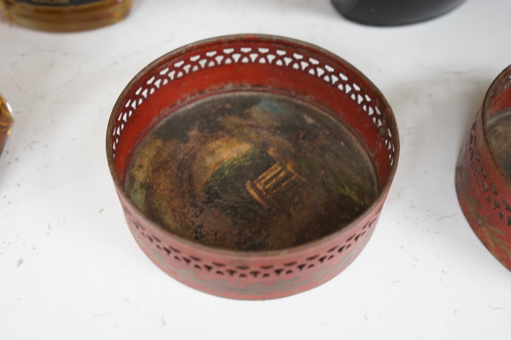 A George III silver and Old Sheffield plate mounted toleware teapot and a pair of red japanned toleware wine coasters, teapot 28cm wide (3)